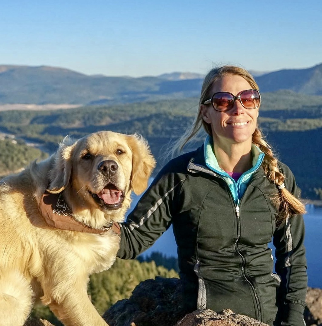 Woman hiking with a golden retriever at sunset overlooking mountain ridges — pet sitter enjoying the outdoors with animals.” about Southern California Pet Sitting